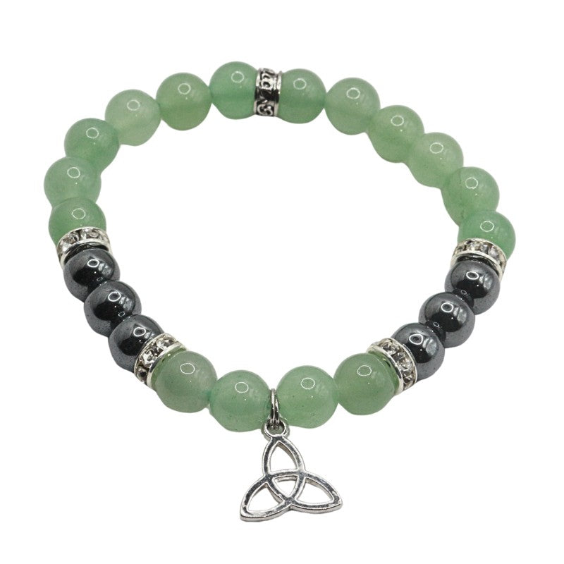 Green beaded bracelet with black beads and a silver Trinity knot charm on a white background
