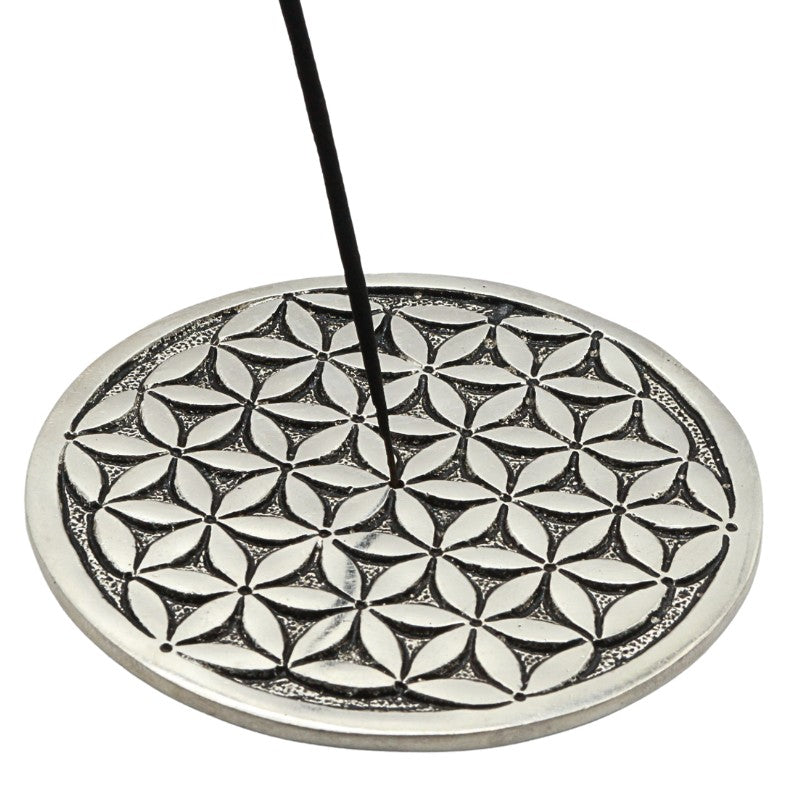 incense stick in a aluminium flower of life incense burner