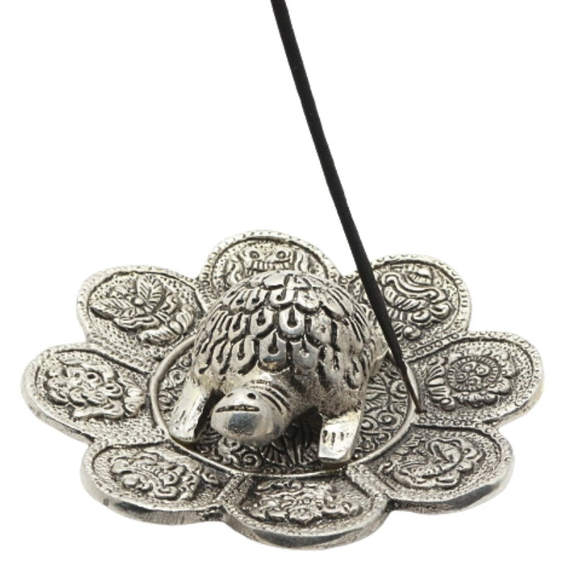 stick of incense in a turtle aluminium incense burner