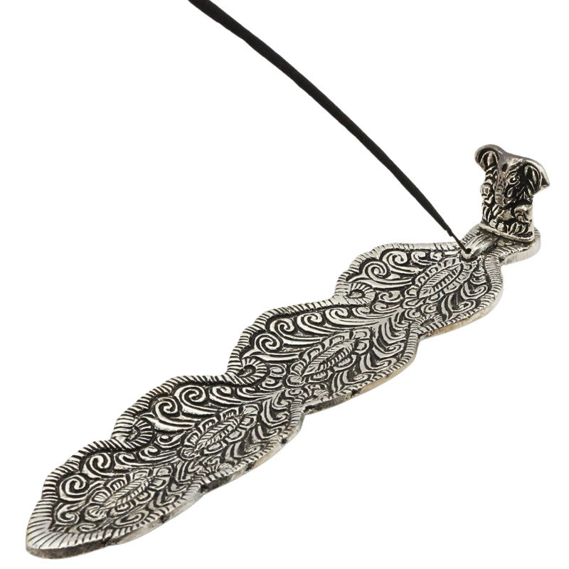 aluminium incense burner with ganesh and an incense stick