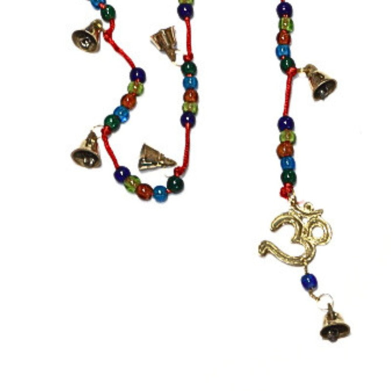 string of brass bells on colourful beaded cord with om symbol