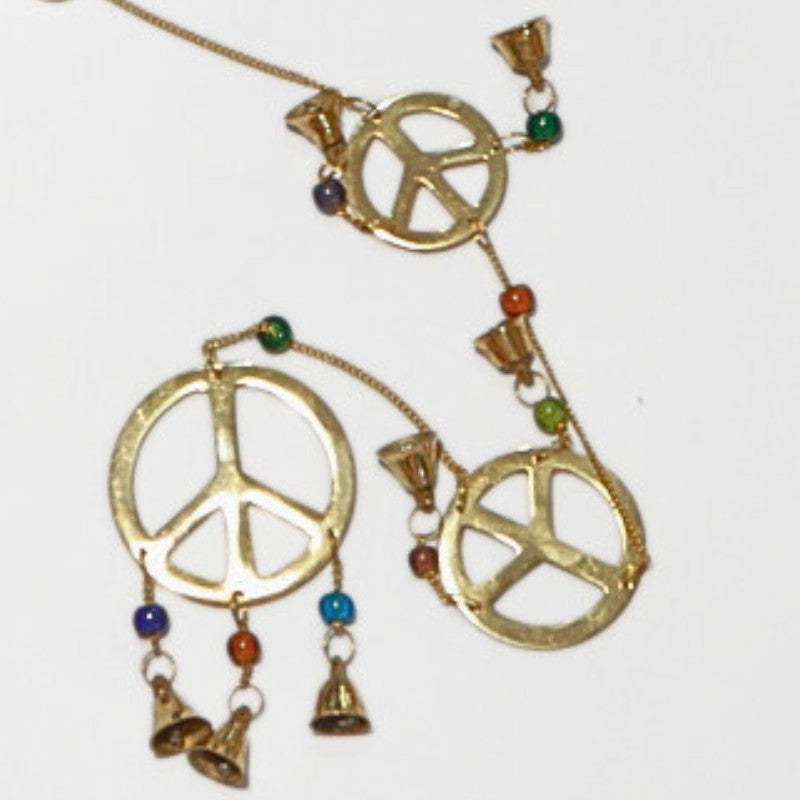 brass bells with peace sign
