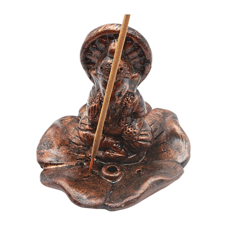 Copper-coloured clay incense holder with a stick on a white background