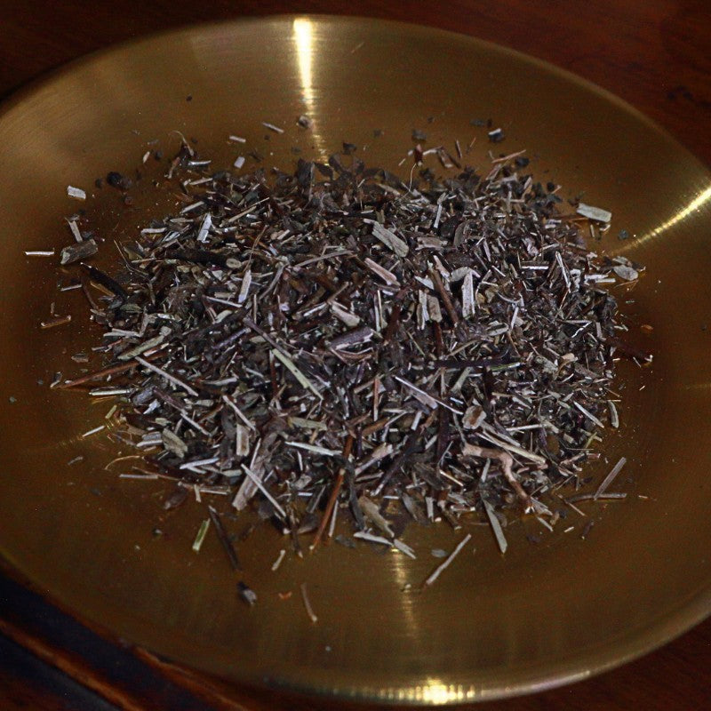 Dry herbs or spices on a metallic surface
