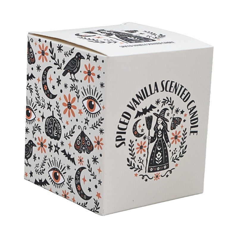 White packaging box with black and orange design saying :spiced vanilla scented candle"