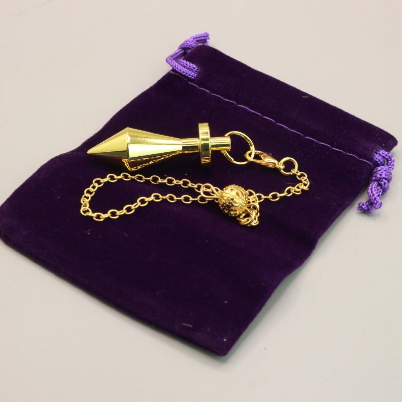 Gold Pendulum On Purple Velvet Bag