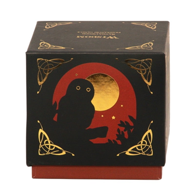 Candle gift box in black with a red and gold owl on front with the word "wisdom" written in gold on top