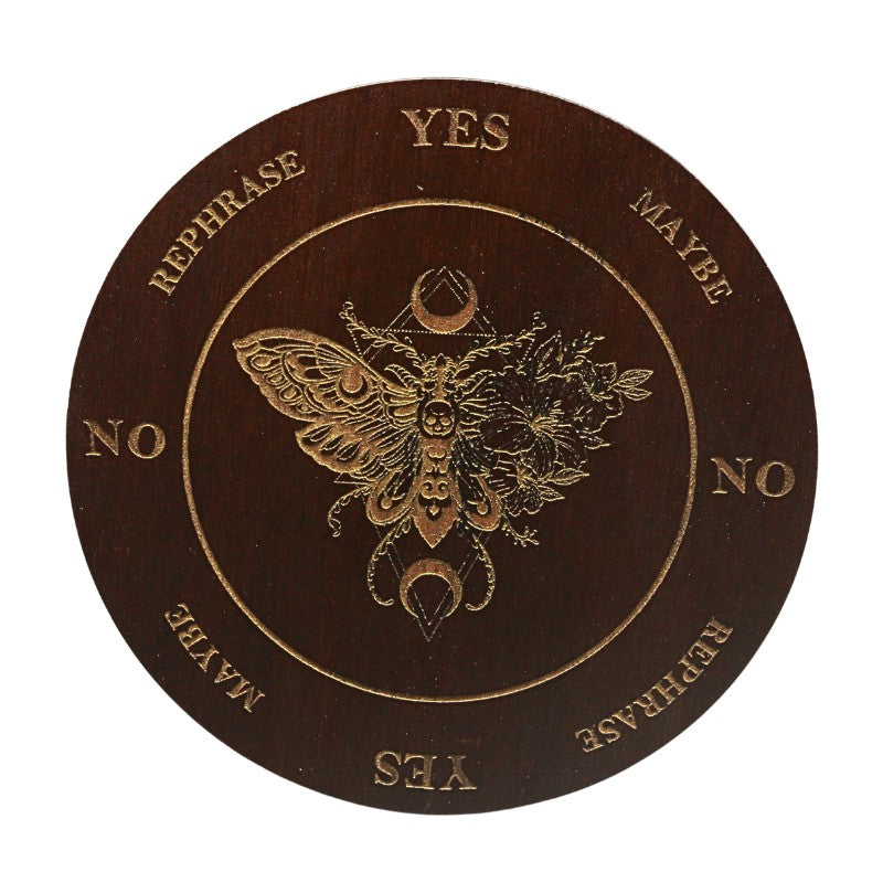 Decorative circular object with moth design and decision-making text on a white background