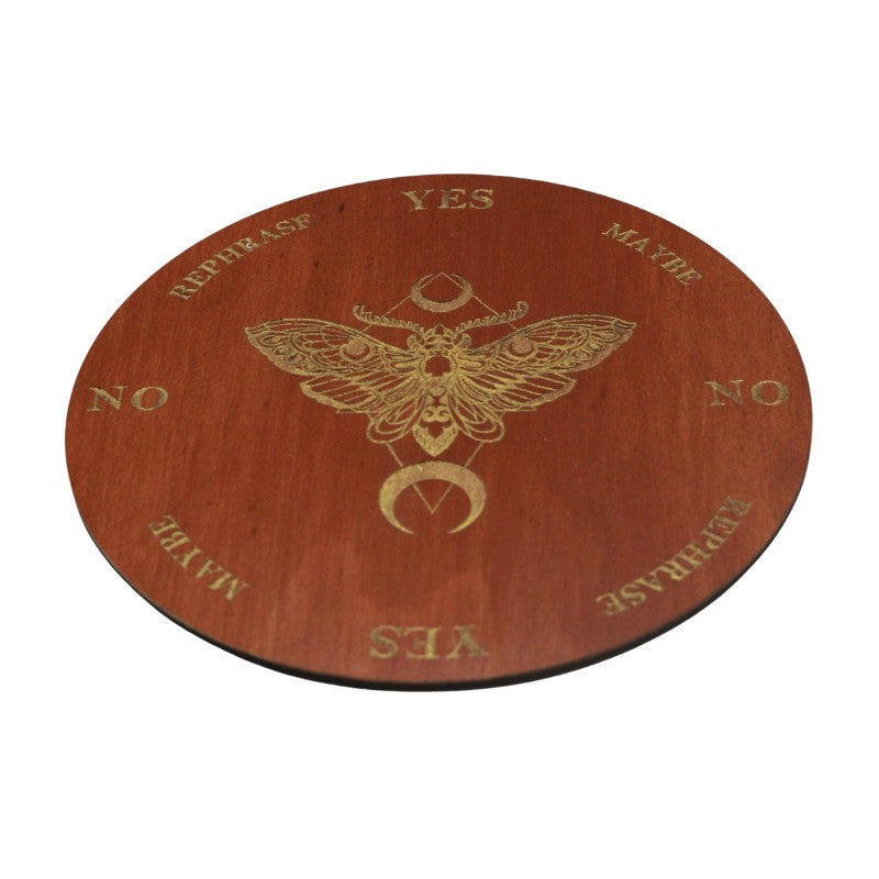 round wooden board painted maple with a gold death's head moth design on a white background