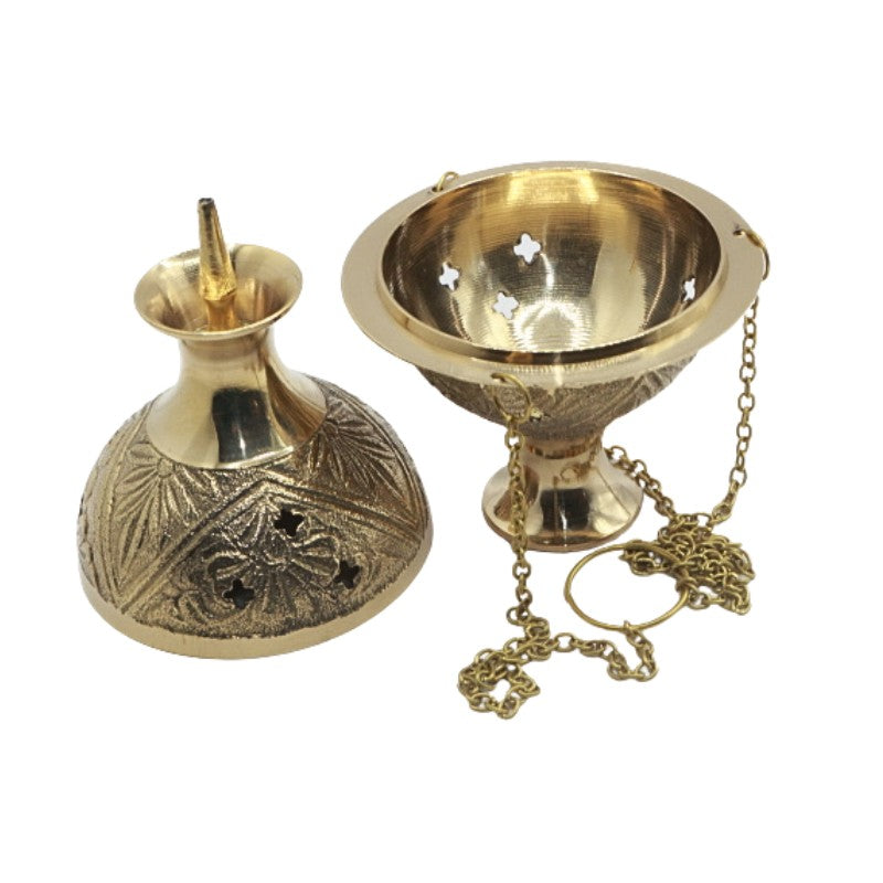 Gold incense burner with decorative chain on a white background
