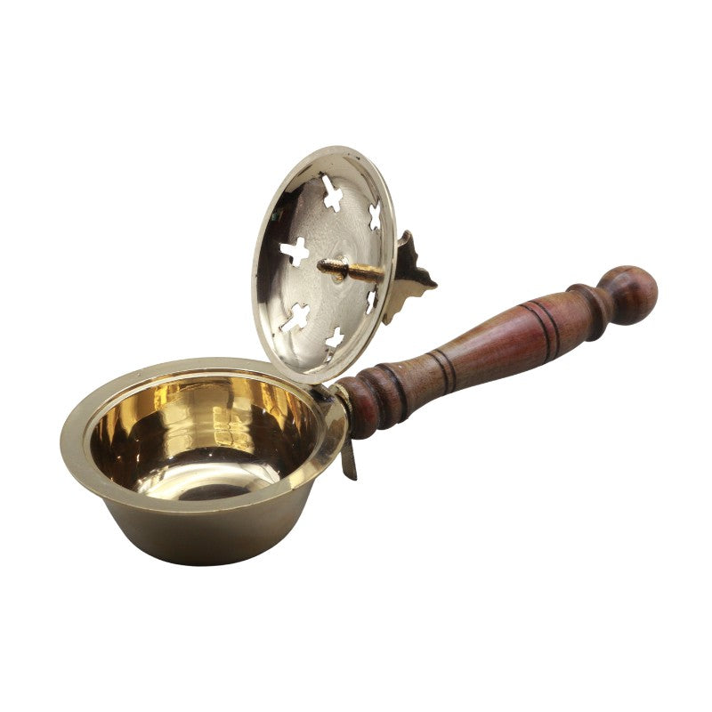 Brass charcoal burner with wooden handle on a white background