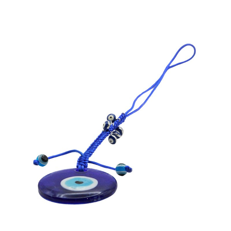 Blue evil eye charm with a string on a white background