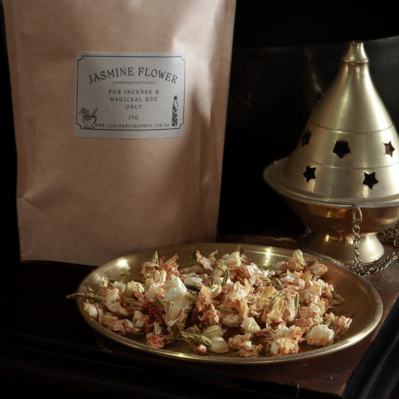 Jasmine flower package with a gold tray of dried flowers and a brass incense burner.