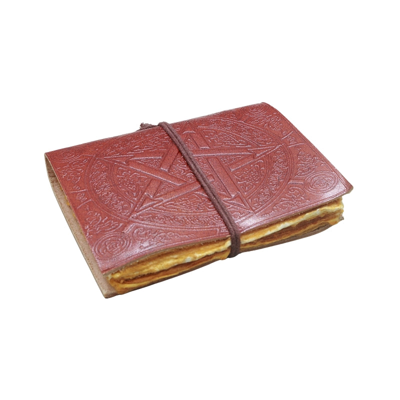 brown leather journal, embossed with image of a pentacle, with a brown tie, on a white background