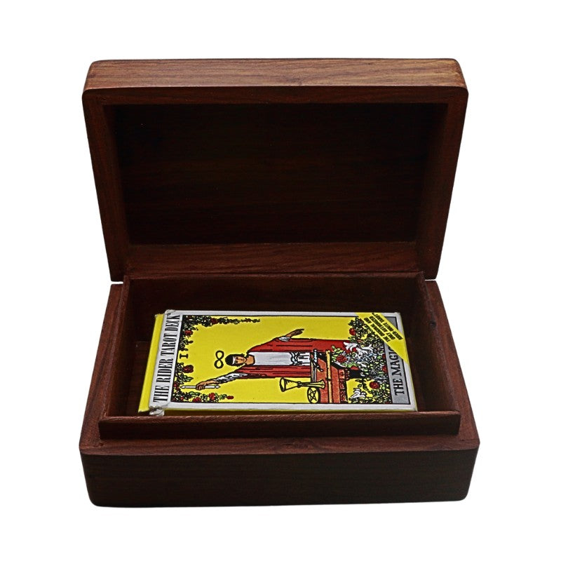 Wooden box with a tarot card inside on a white background