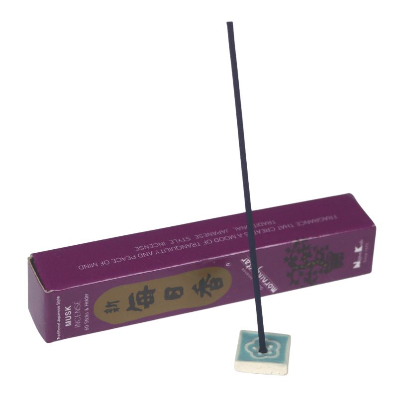 rectangle box of japanese morning star "Musk" incense sticks next to a tile incense holder