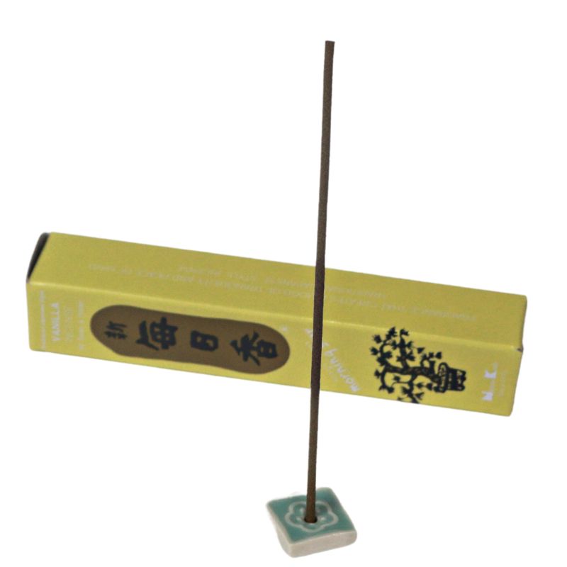 rectangle box of japanese morning star "Vanilla" incense sticks next to a tile incense holder