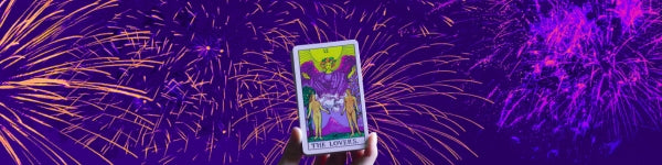 fireworks on a purple background with the lovers tarot card in front