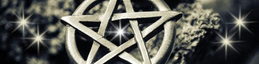 silver pentacle on dark background with a star in the centre and at each side