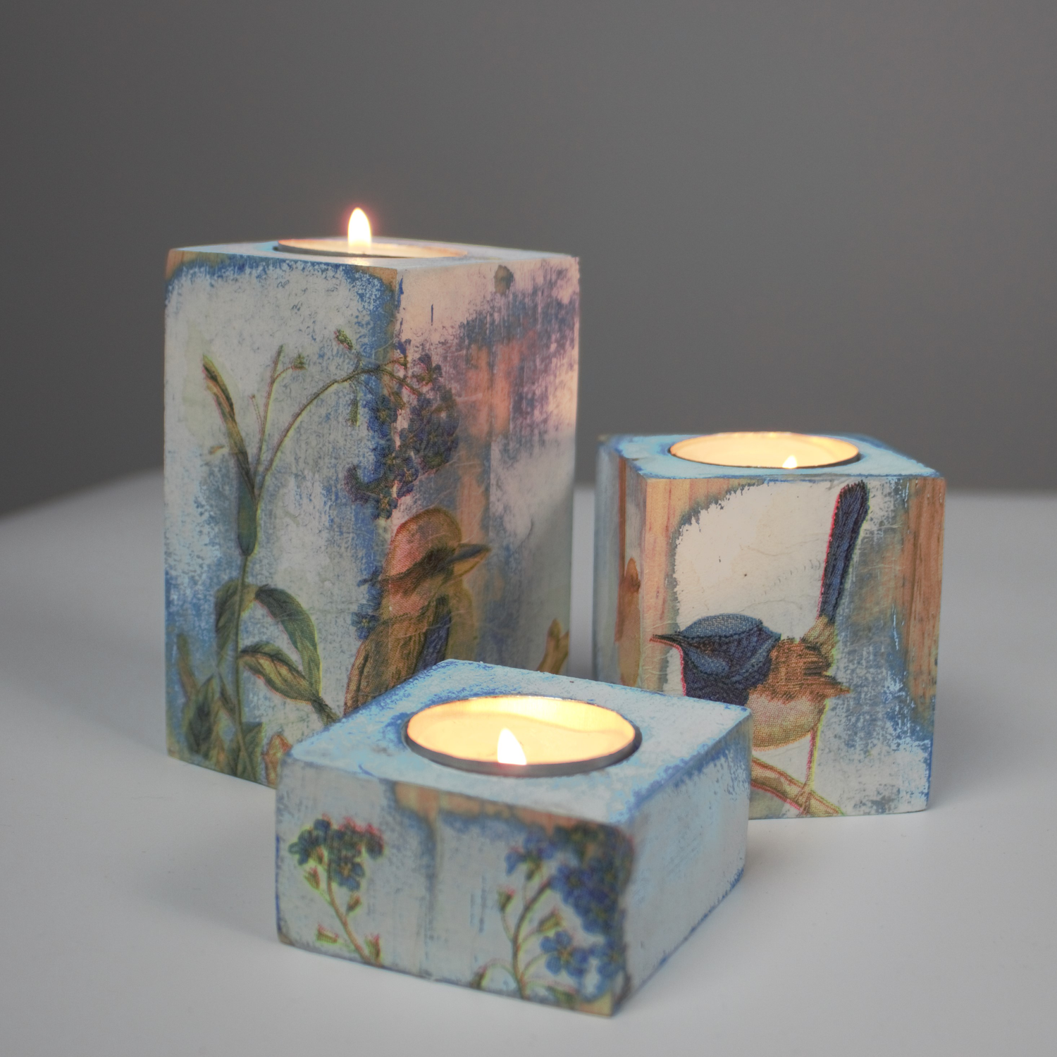 3 piece candle holder set blue with birds & lit candle