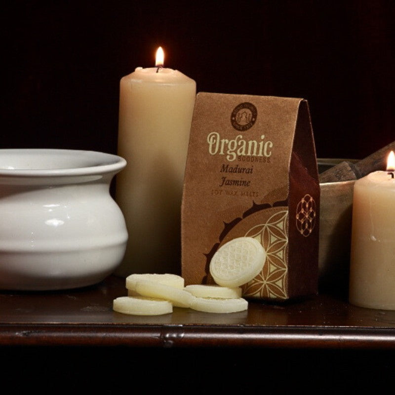 pack of organic goodness wax melts, wax melts in front of a singing bowl, beeswax candles and oil burner