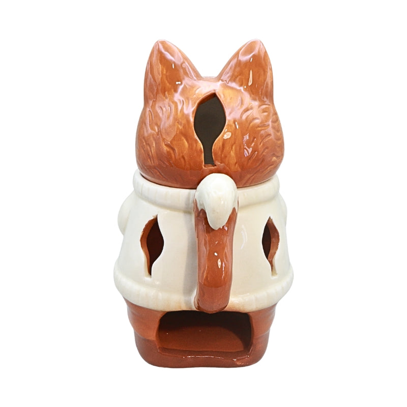 A ceramic fox-shaped candle holder or tea light holder with a glossy brown and cream glaze, shown against a plain white background.
