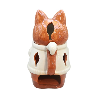 A ceramic fox-shaped candle holder or tea light holder with a glossy brown and cream glaze, shown against a plain white background.