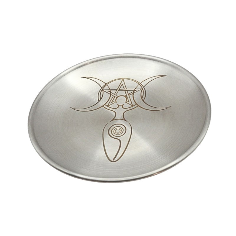 Metallic dish with engraved goddess symbol on a white background