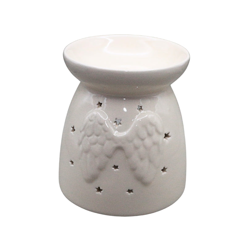 A white ceramic oil burner with a relief of angel wings and small star cutouts, shown on a plain white background.