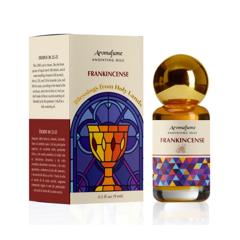Bottle of anointing oil with colourful label next to packaging box