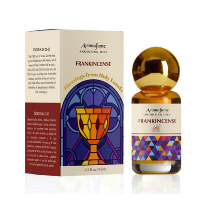 Bottle of anointing oil with colourful label next to packaging box