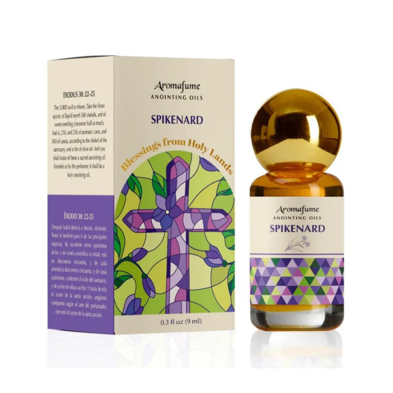 Bottle of anointing oil with colourful label next to packaging box
