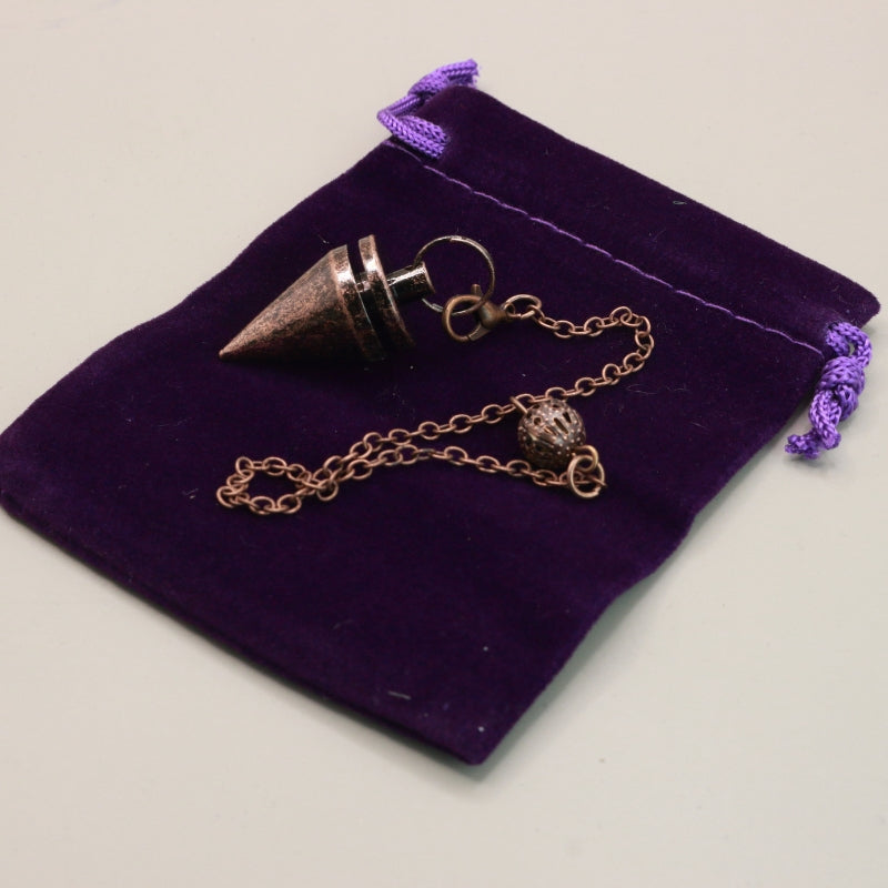 Antique Copper Pendulum On purple bag