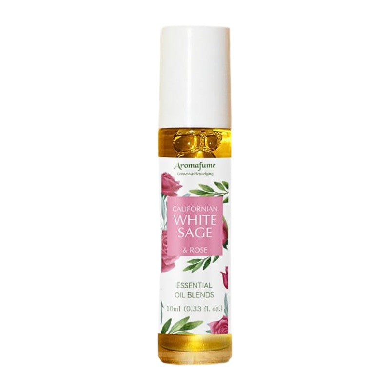 glass bottle containing oil with a white, pink and green floral  label
