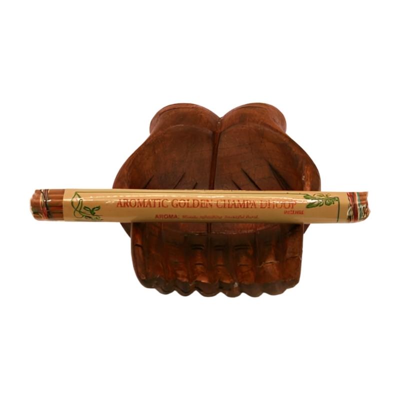 pk of natural tibetan dhoop incense on a pair of open wooden carved hands