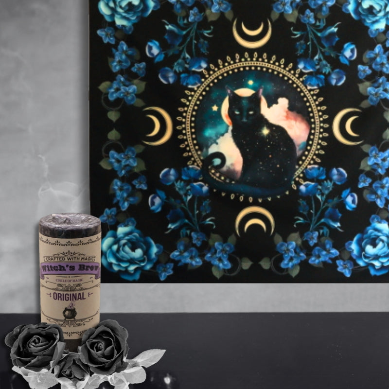 Black Cat Familiar  Wall Hanging  behind a witches brew candle and black roses