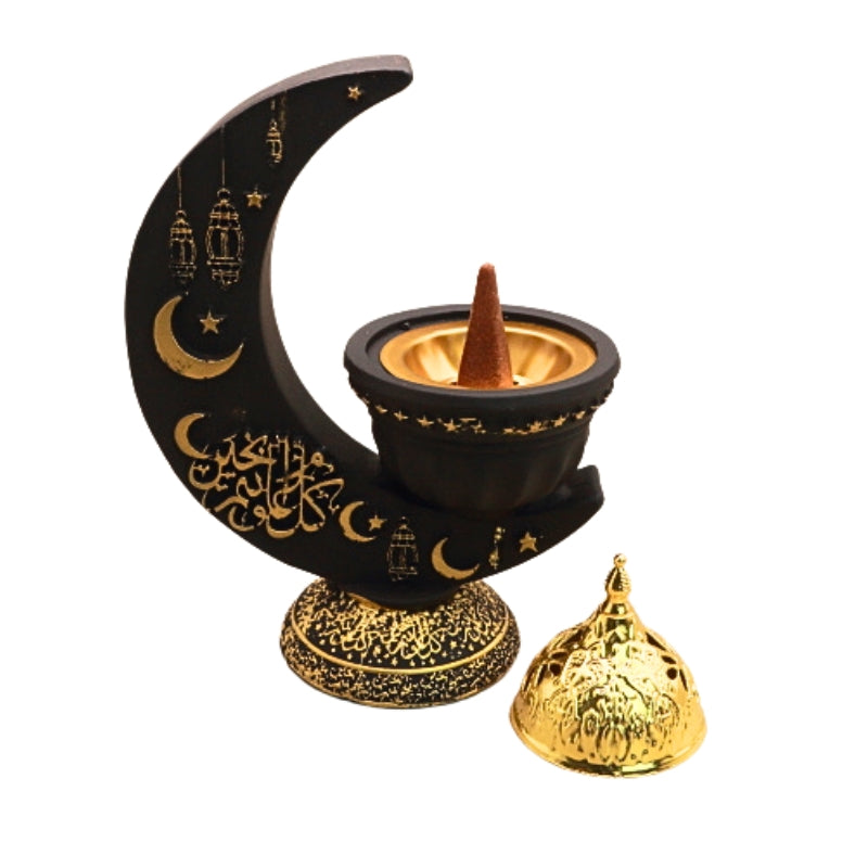 black and gold incense burner in the shape of a crescent moon