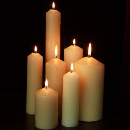 group of beeswax pillar candles