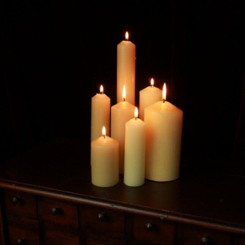 group of beeswax pillar candles