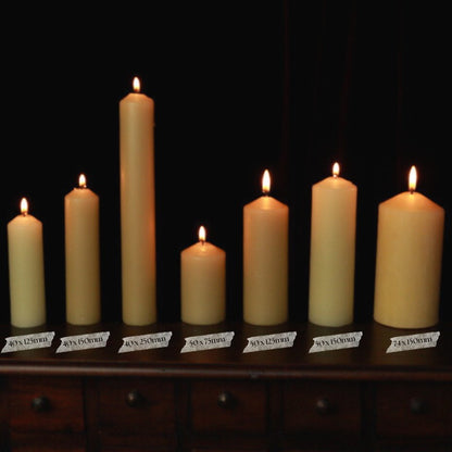 7 beeswax pillar candles in a row