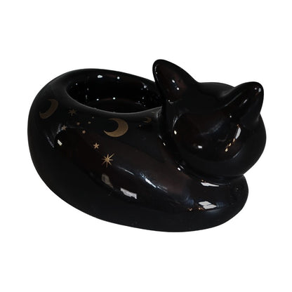 Black cat-shaped ceramic tealight hoider with star and moon designs on a white background