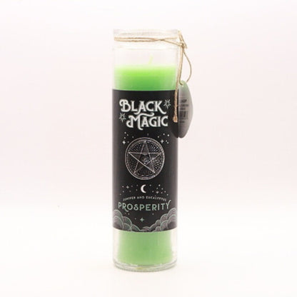 green prosperity spell candle in a glass jar