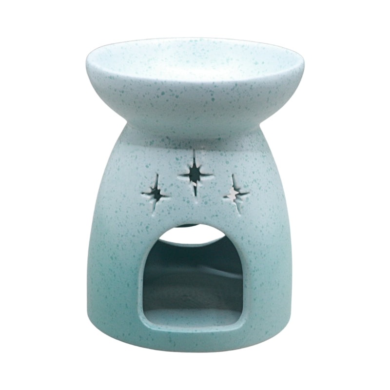 A light blue speckled ceramic oil burner candle holder with star cutouts on the front, shown against a plain white background.