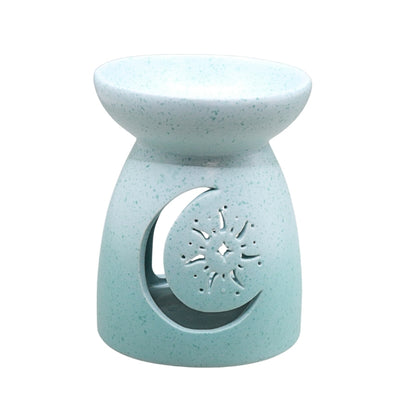 A light blue speckled ceramic oil burner candle holder with a crescent moon and star cutout on the front, shown against a plain white background.