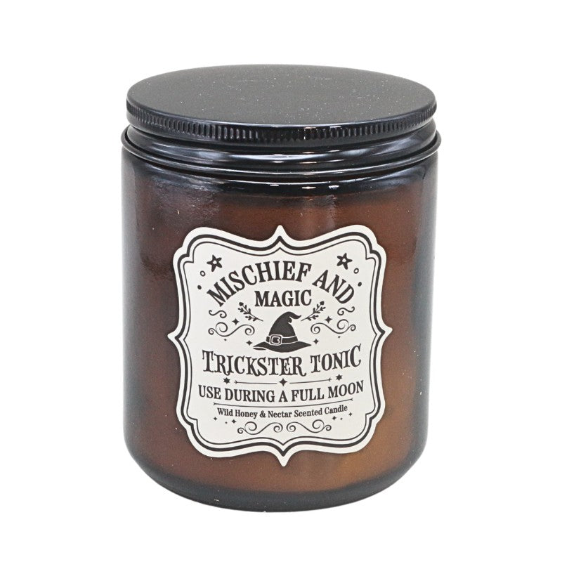 Brown Amber Glass jar with a black lid,  white label  and a witches hat design