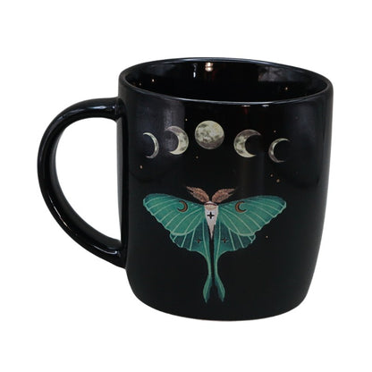Black mug with Luna moth and moon phase design on white background
