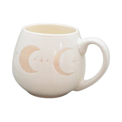 cream mug with crescent moon images on a white background