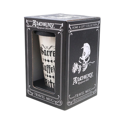 A white ceramic travel mug with black gothic lettering, displayed inside its black branded retail box. The packaging features the Alchemy brand name, 'Home & Gift Collection' text, and a skull-and-rosette illustration.