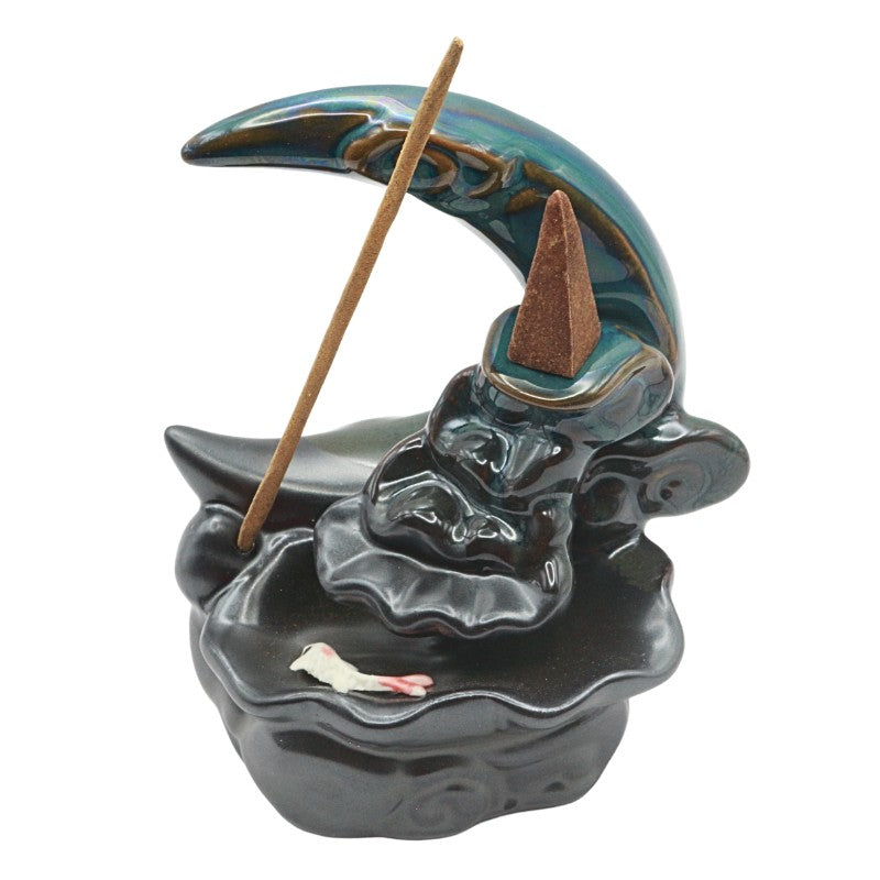 Ceramic backflow burner shaped like a crescent moon on a white background