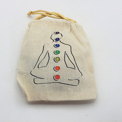 Beige drawstring bag with a chakra symbol on a white background